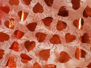 red hearts on white lace